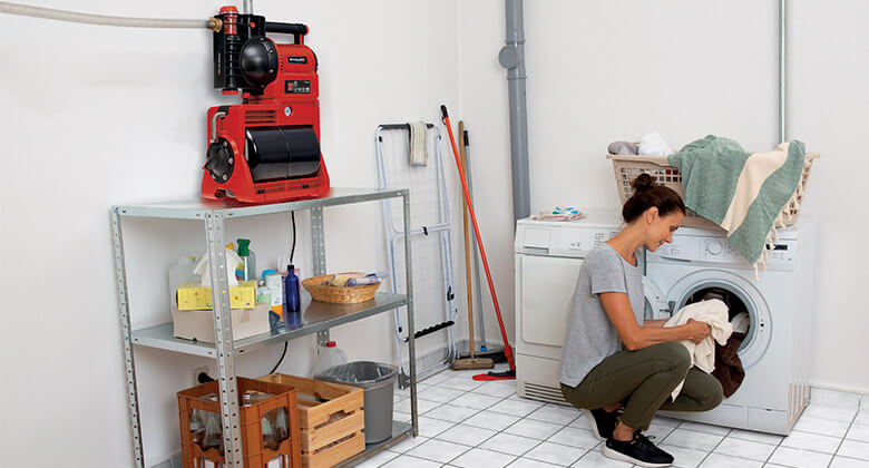 woman with a domestic water work in a laundry room
